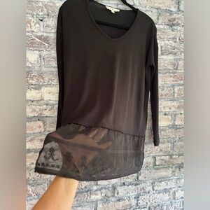 Gorgeous black top with beautiful lace trim bottom. Excellent condition